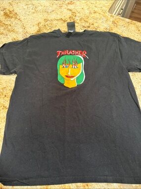 Thrasher Black Tee with Green-Haired Face and Red Logo
